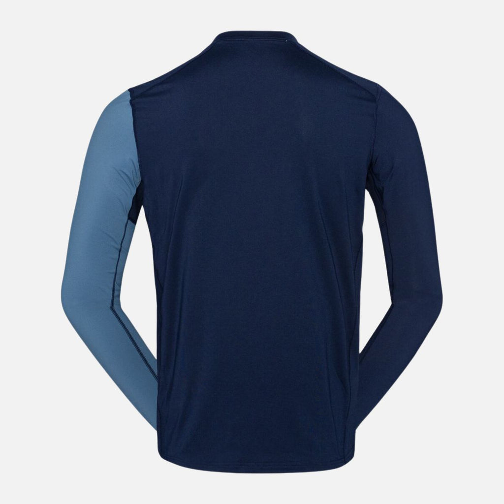 Navy long-sleeve athletic shirt with a small blue sleeve on a light gray background